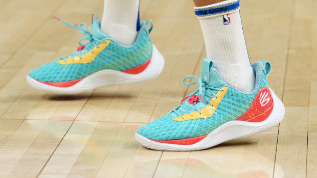 View of Stephen Curry's teal and red Under Armour shoes.